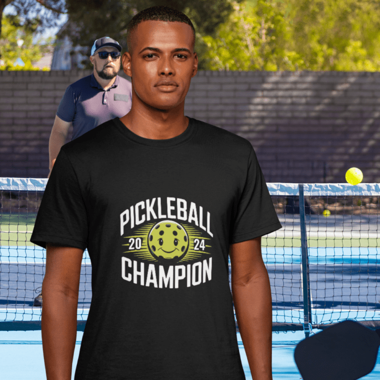 Black T-shirt with design of pickleball in centre and words, Pickleball Champion