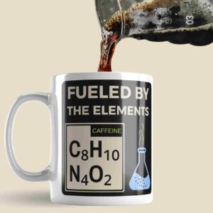 a coffee mug that has the chemical formulae for Caffeine on it, and the words fuelled by the elements