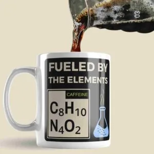 a coffee mug that has the chemical formulae for Caffeine on it, and the words fuelled by the elements
