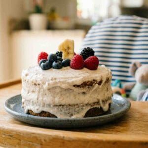 smash cake fpor a 1st birthday party on a highchair