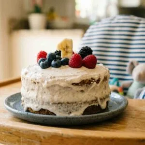 smash cake fpor a 1st birthday party on a highchair