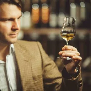 a man tasting whiskey